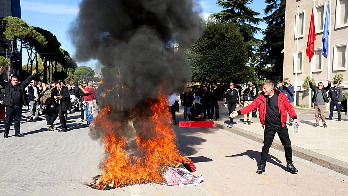 Albanian opposition burns pillows outside PM's office as protests grow