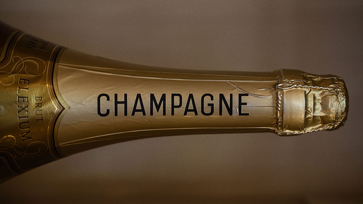 Champagne harvest halves, but cellars cushion the blow