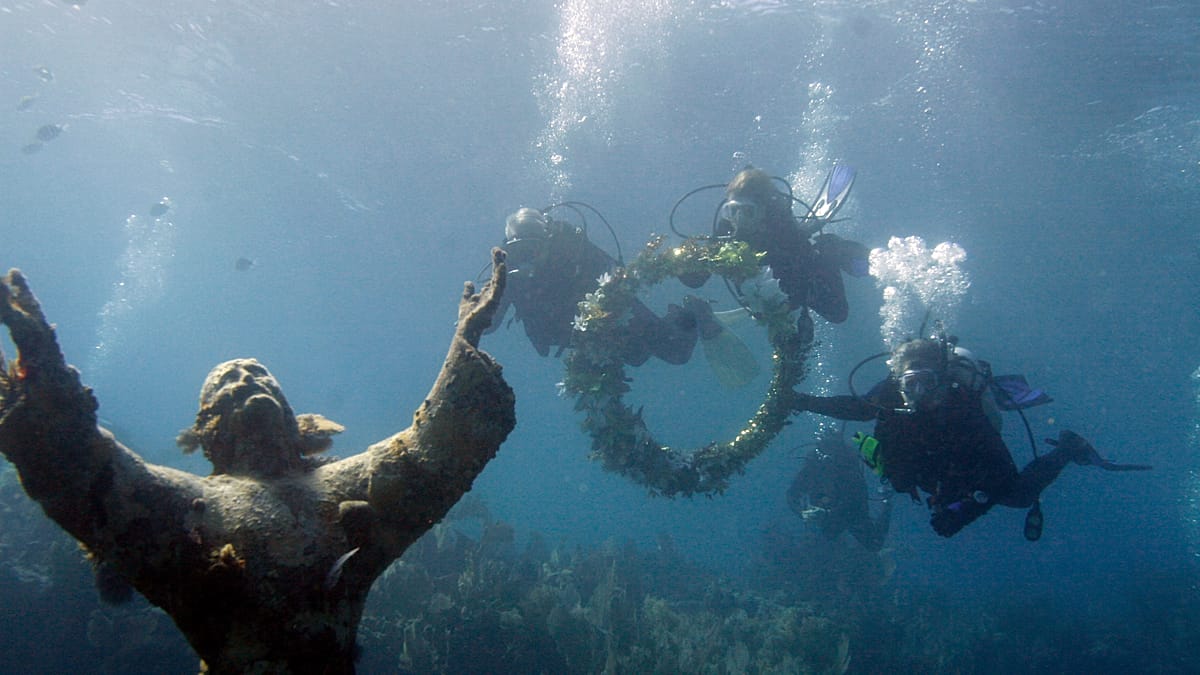 Divers clean Italy's Christ of the Abyss statue in Ligurian Sea