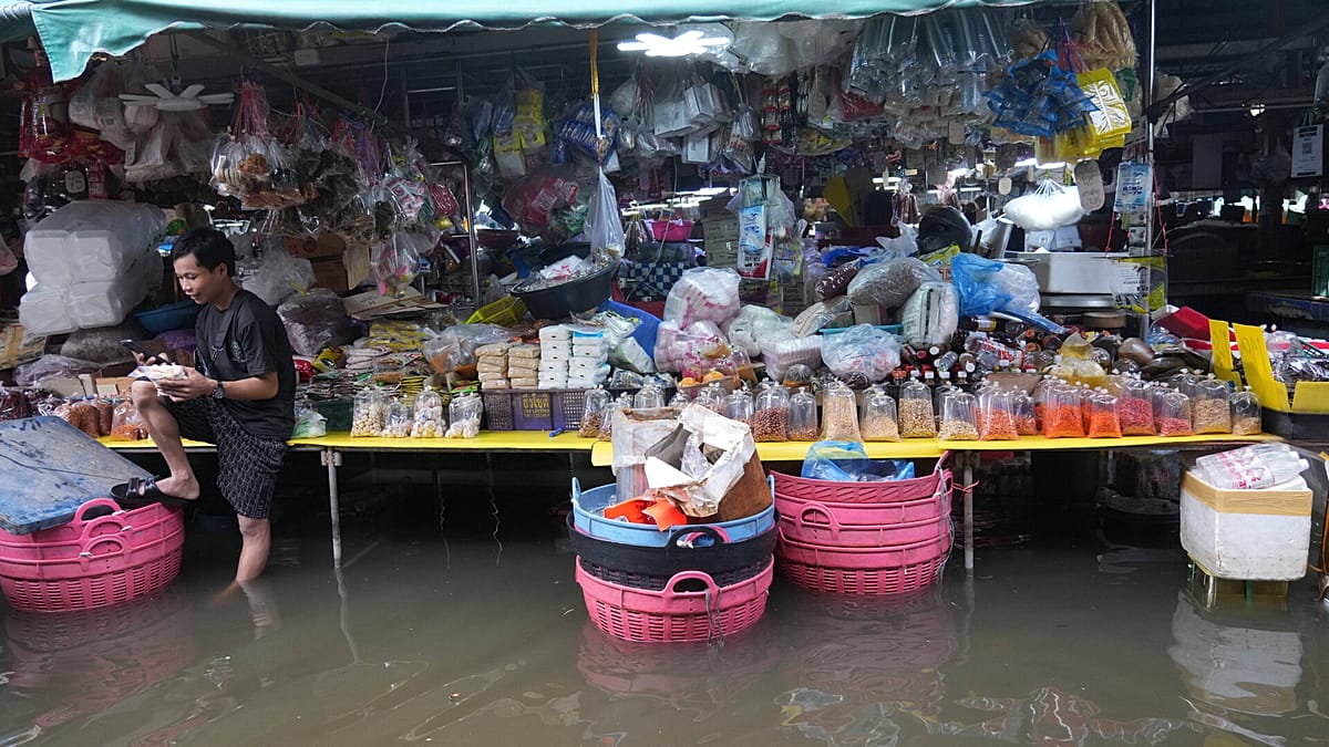 Flooded Thai villages bear the cost of protecting Bangkok from rising waters