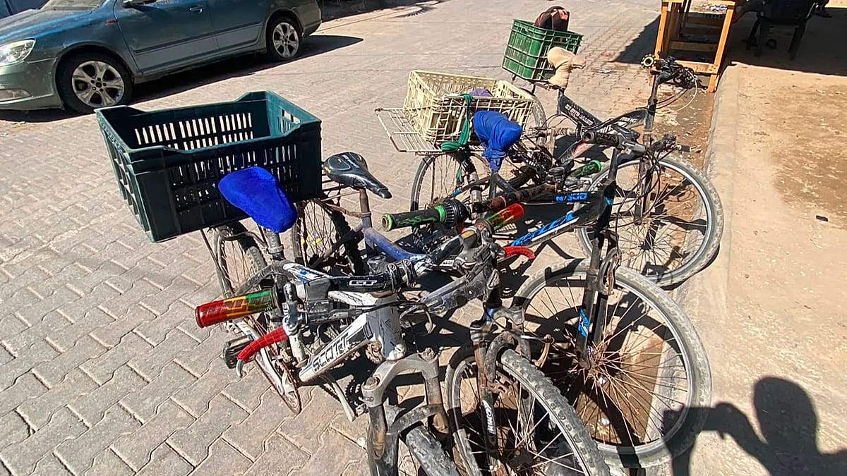 Gaza's bicycle couriers endure danger and meagre pay to keep deliveries moving