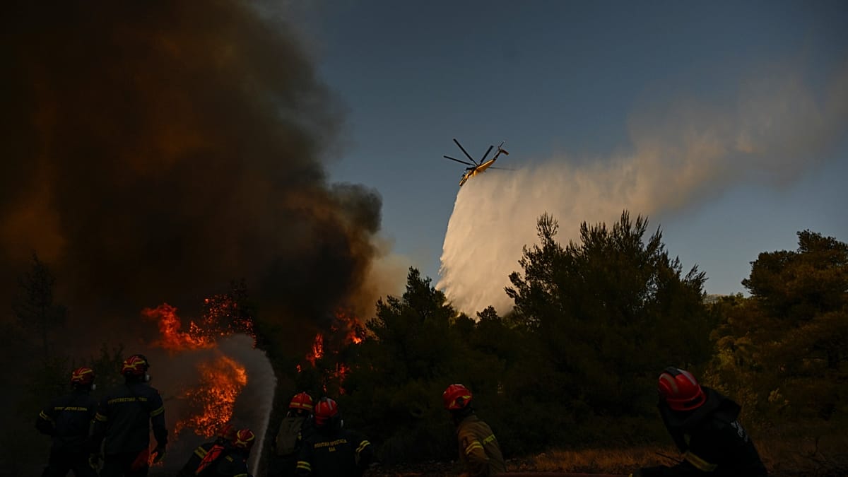 Greece wildfire claims two helicopter crew as Athens region remains on alert