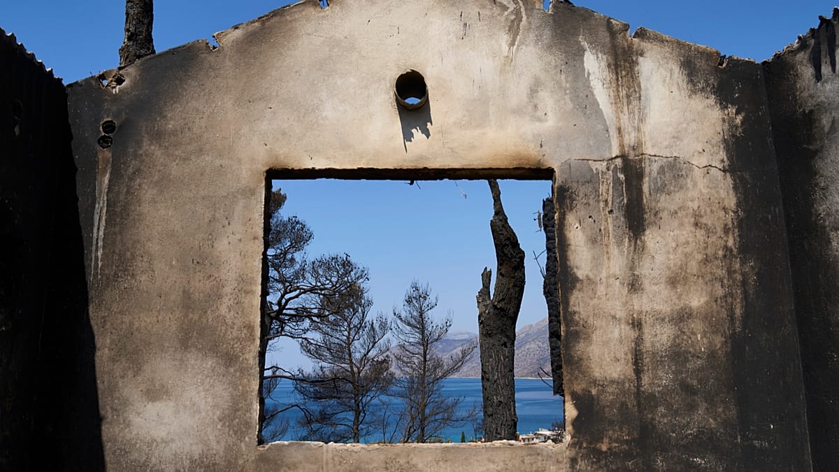 Greek crews race to contain Athens wildfire before winds return