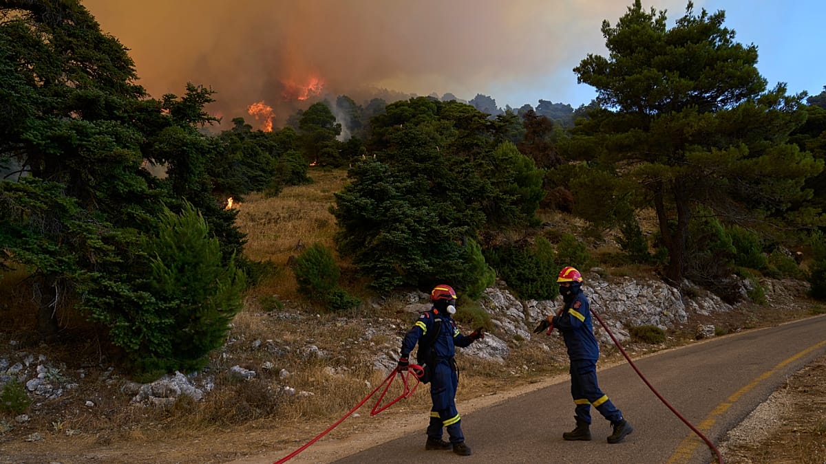 Greek firefighters battle large blaze west of Athens as winds persist