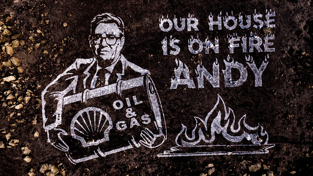 Greenpeace paints 'Our house is on fire, Andy' on wildfire-scorched Welsh hillside