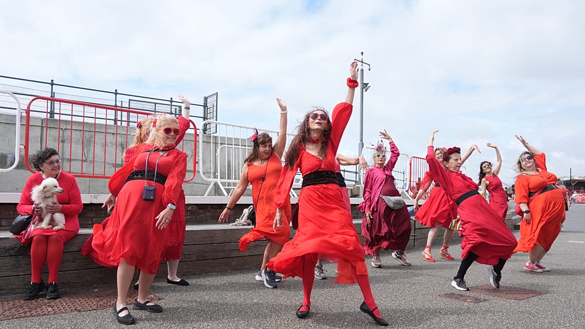 Hundreds in red recreate Kate Bush's Wuthering Heights dance across Europe