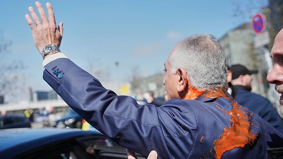 Iran's Exiled Crown Prince Reza Pahlavi Hit with Red Liquid at Berlin Press Event