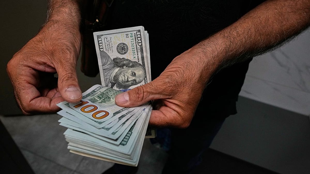 Iranian rial plunges to record low as dollar tops 22 million tomans