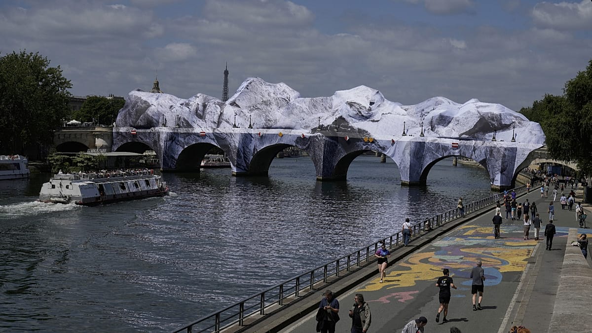 JR Transforms Paris's Pont Neuf into a Giant Cave Installation
