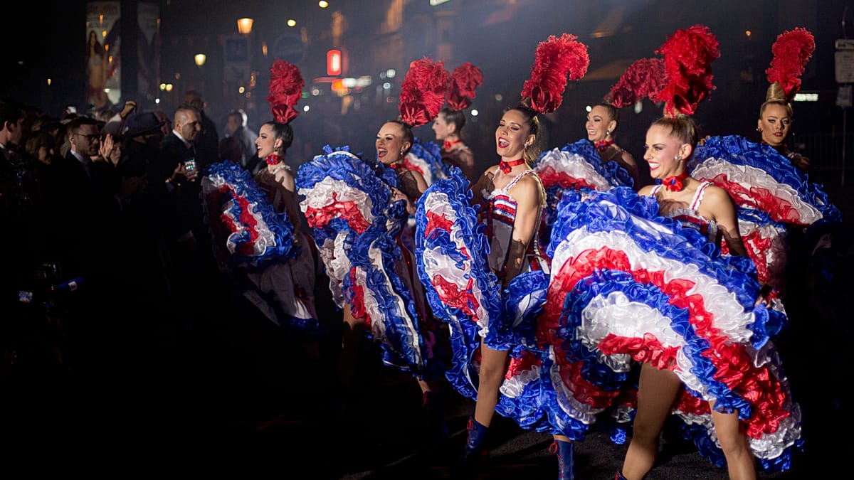 Moulin Rouge cancan dancers celebrate Tour de France finale in Paris