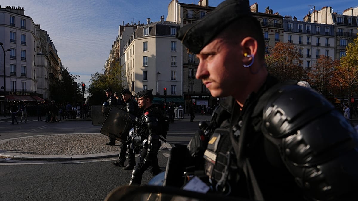 Paris student protests turn violent as police fire tear gas