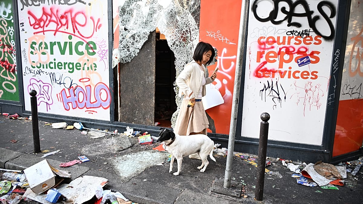 Parisians survey wreckage after weekend protests over costs and schools