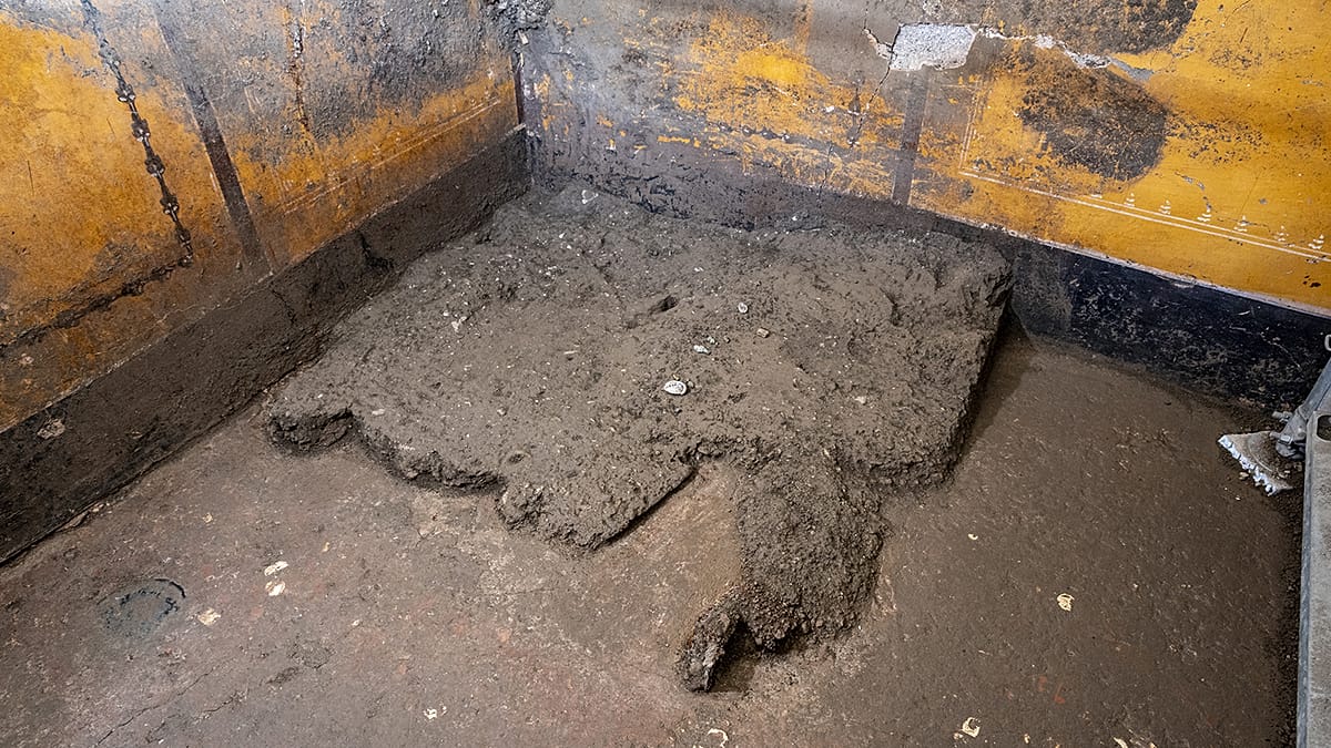 Pompeii excavation reveals woman's wardrobe with amulets and coins