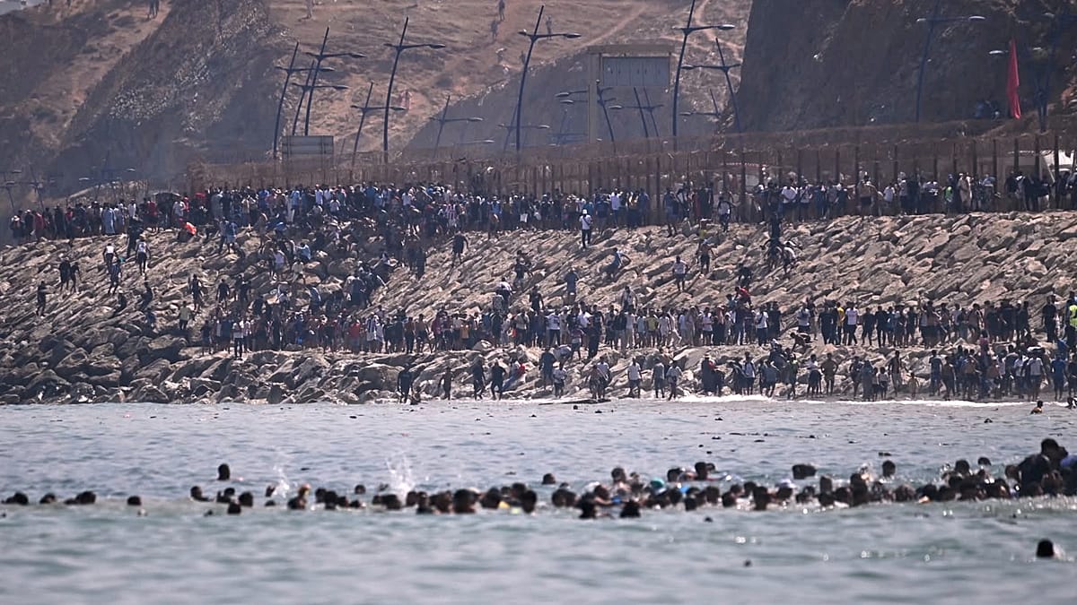 Thousands cross into Spain's Ceuta from Morocco, prompting emergency call