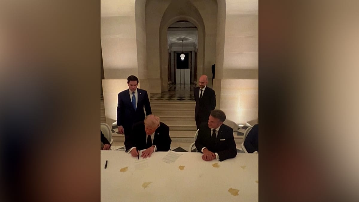 Trump Signs Interim Iran Deal at Versailles with Macron at His Side
