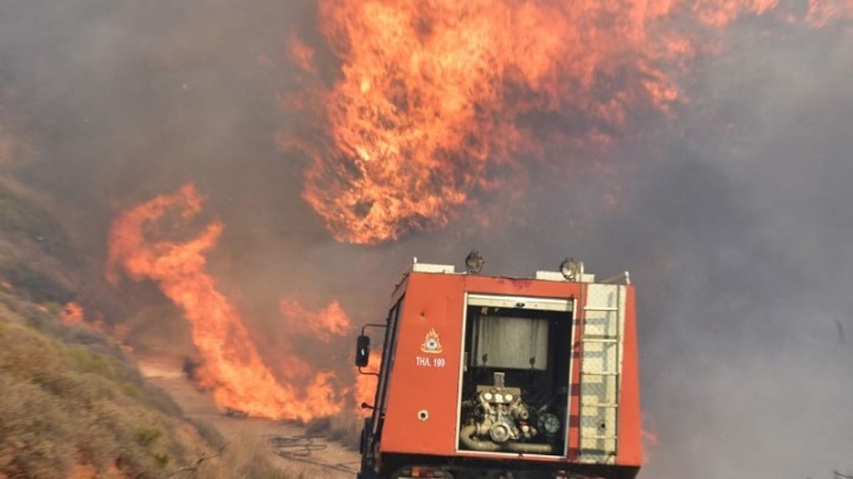 Wildfire on Paros forces evacuations as strong winds threaten to spread flames