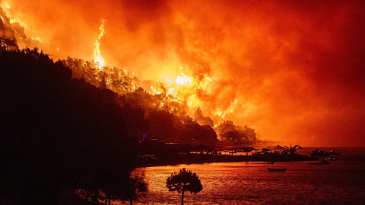Wildfires force mass evacuations across Europe as heatwave persists